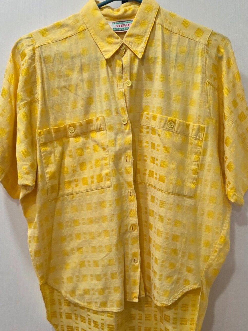 Vibrant sunshine yellow tone button top